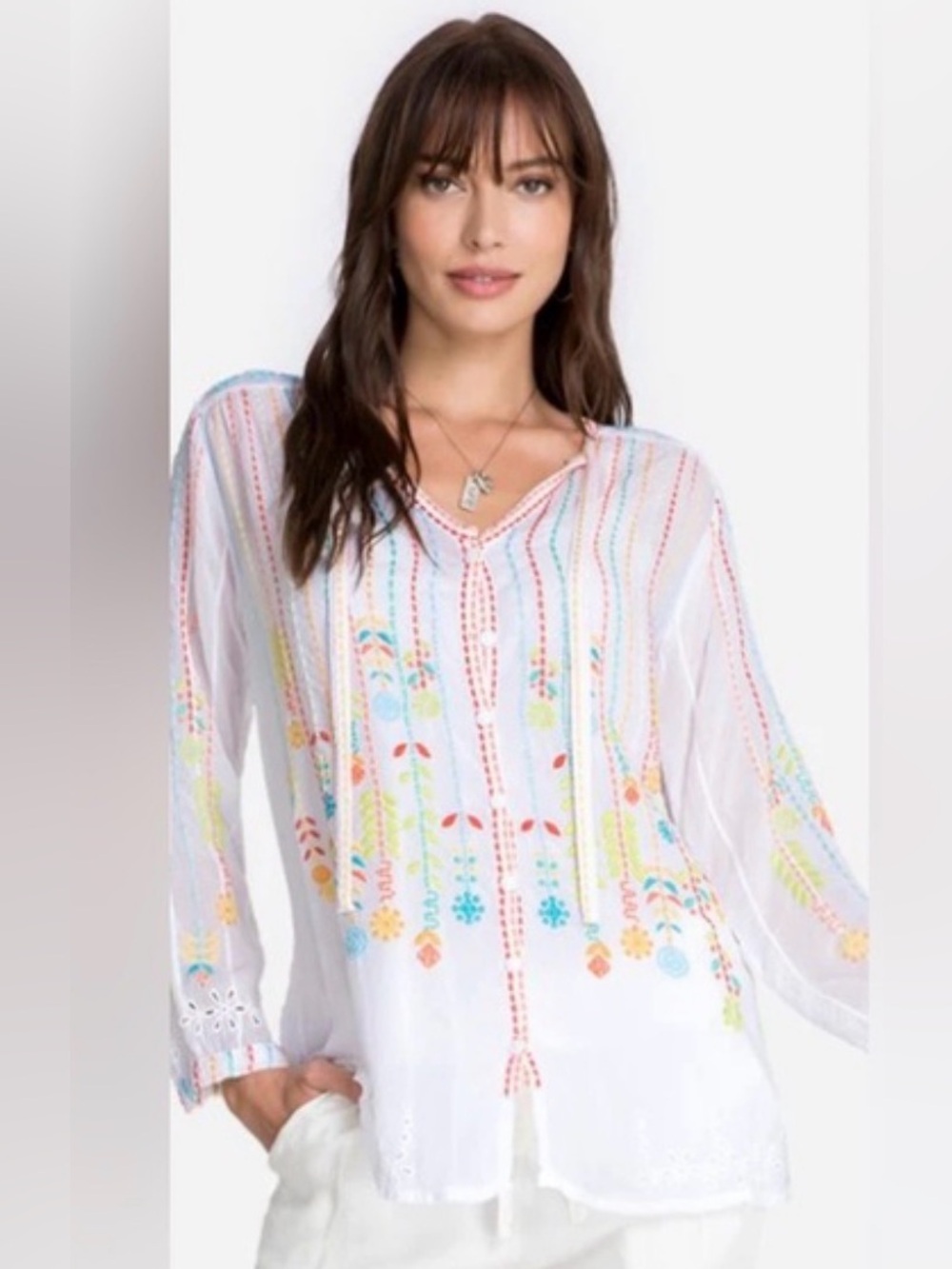 Johnny was “Stitch Blouse”. White open front embroidered. Size M